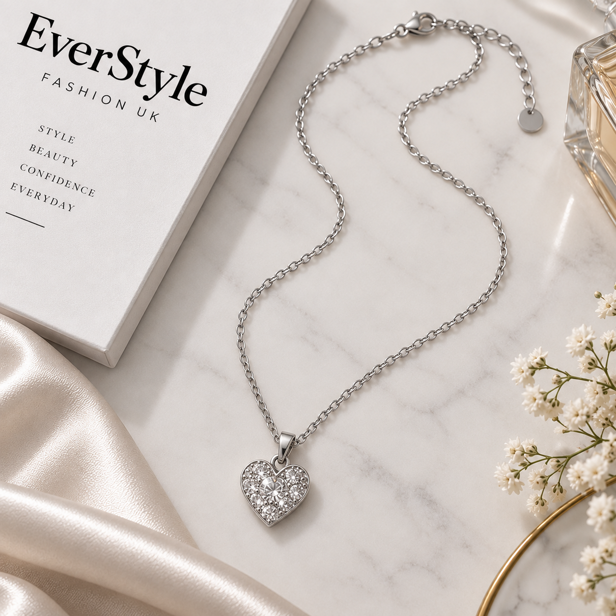 Silver chain necklace with a crystal-set heart pendant